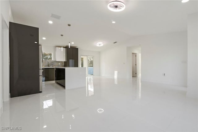 unfurnished living room featuring light tile patterned floors