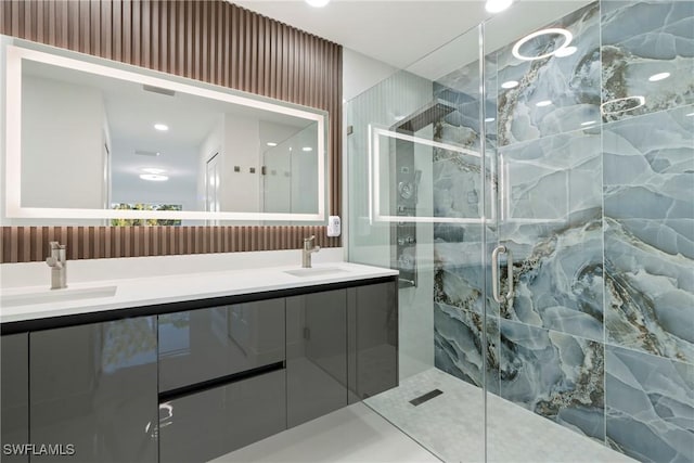 bathroom with vanity and an enclosed shower