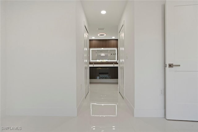 3306 E 7th St, Lehigh Acres, FL 33972 - hallway featuring tile patterned floors and recessed lighting