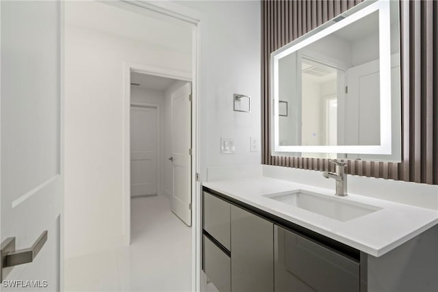 bathroom with tile patterned flooring and vanity