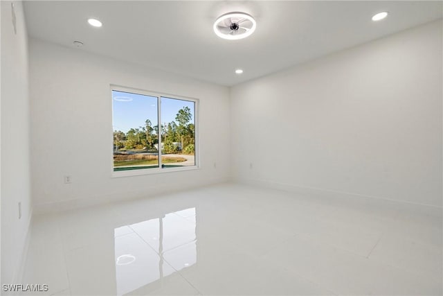 3306 E 7th St, Lehigh Acres, FL 33972 - tiled spare room featuring recessed lighting