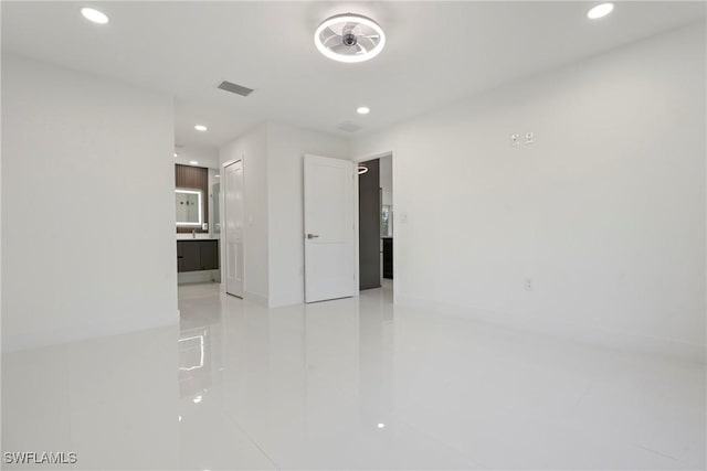 3306 E 7th St, Lehigh Acres, FL 33972 - empty room featuring recessed lighting and light tile patterned floors