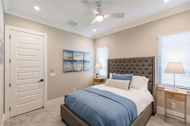 carpeted bedroom with ceiling fan and crown molding