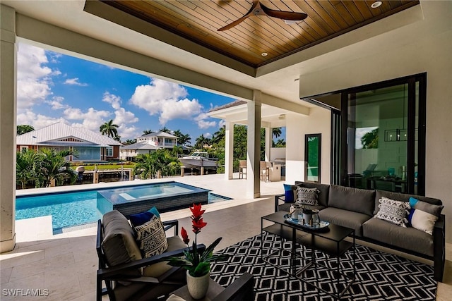 view of pool featuring outdoor lounge area, a patio area, area for grilling, and ceiling fan