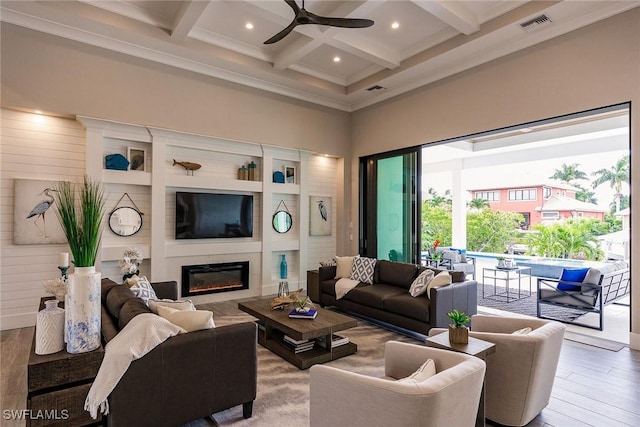 living room with ceiling fan, hardwood / wood-style floors, beamed ceiling, and coffered ceiling