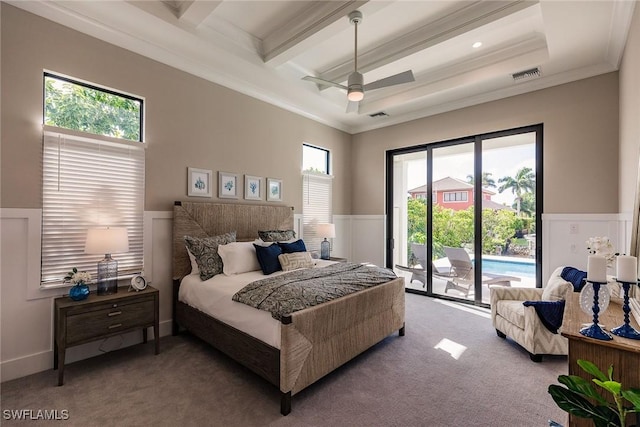 bedroom featuring beam ceiling, carpet floors, access to outside, and multiple windows