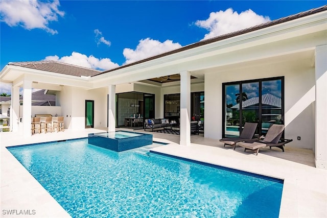 view of pool with a patio area, an in ground hot tub, and an outdoor bar