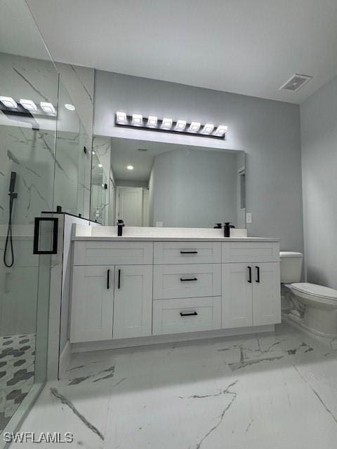 bathroom featuring vanity, an enclosed shower, and toilet