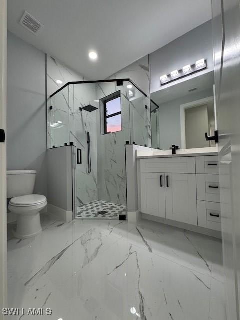 bathroom with vanity, toilet, and an enclosed shower