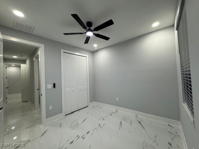 unfurnished bedroom with a closet and ceiling fan