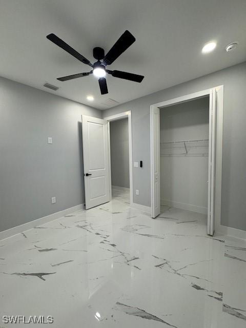 unfurnished bedroom featuring ceiling fan and a closet