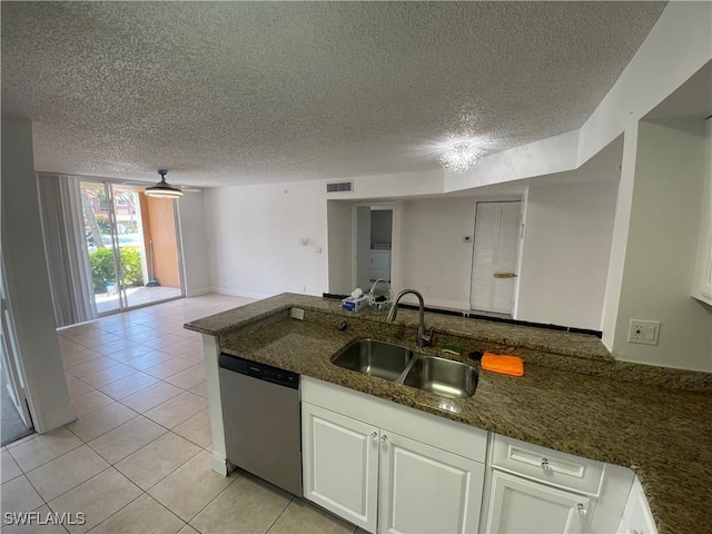 1275 Wildwood Lakes Blvd Unit 105, Naples, FL 34104 - kitchen featuring stainless steel dishwasher, white cabinetry, visible vents, and a sink