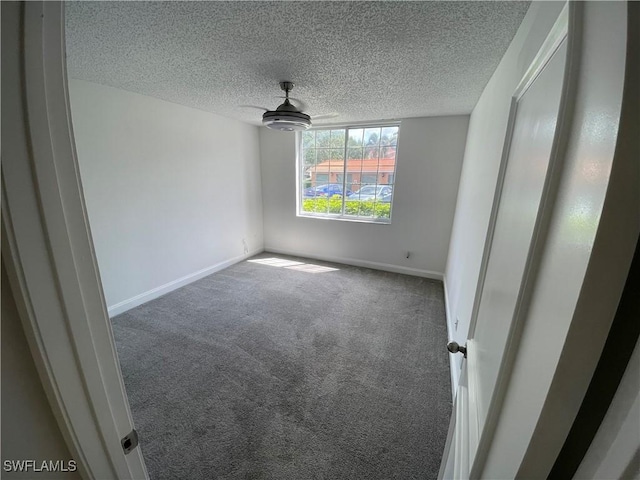 1275 Wildwood Lakes Blvd Unit 105, Naples, FL 34104 - unfurnished bedroom featuring baseboards, carpet, and a textured ceiling