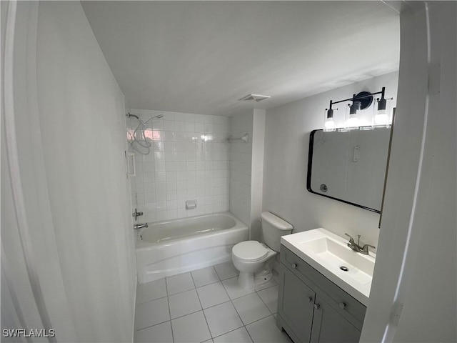 1275 Wildwood Lakes Blvd Unit 105, Naples, FL 34104 - bathroom with visible vents, toilet, vanity, tile patterned flooring, and shower / bathtub combination