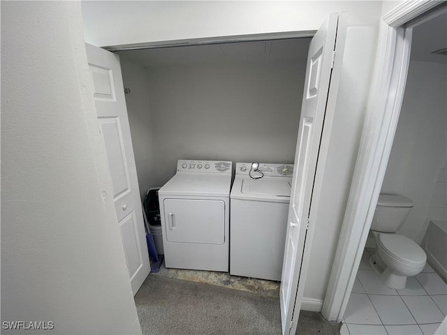1275 Wildwood Lakes Blvd Unit 105, Naples, FL 34104 - clothes washing area featuring independent washer and dryer and laundry area