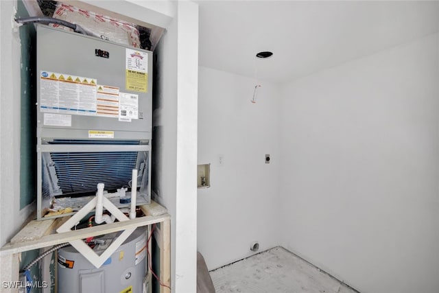 utility room featuring heating unit