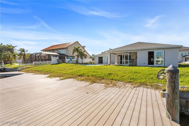 wooden deck with a yard