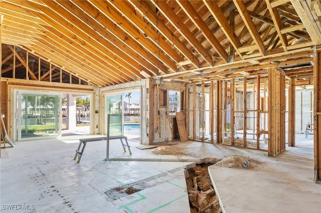 miscellaneous room featuring high vaulted ceiling and a wealth of natural light