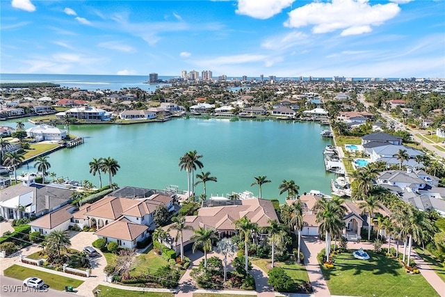 birds eye view of property featuring a water view