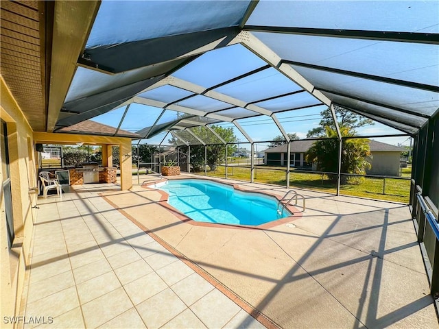 view of swimming pool featuring a lanai, a patio, a yard, and area for grilling