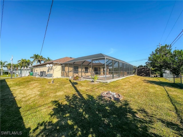 view of yard with glass enclosure