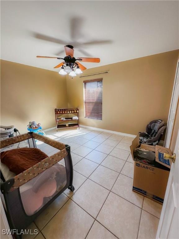 interior space with ceiling fan