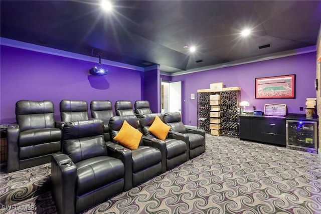 cinema room with bar area, wine cooler, and light carpet