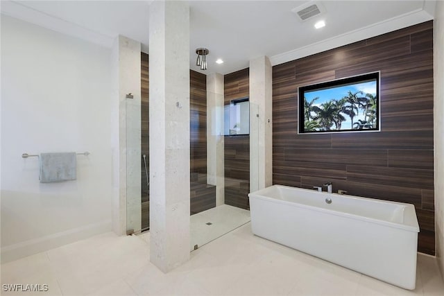 bathroom featuring tile patterned floors, crown molding, and plus walk in shower