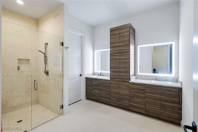 bathroom featuring vanity, tile patterned floors, and a shower with door