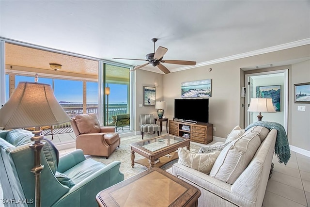 tiled living room featuring ceiling fan and ornamental molding