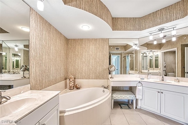 bathroom with tile patterned flooring, vanity, and plus walk in shower