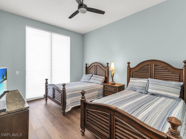 bedroom with wood-type flooring and ceiling fan