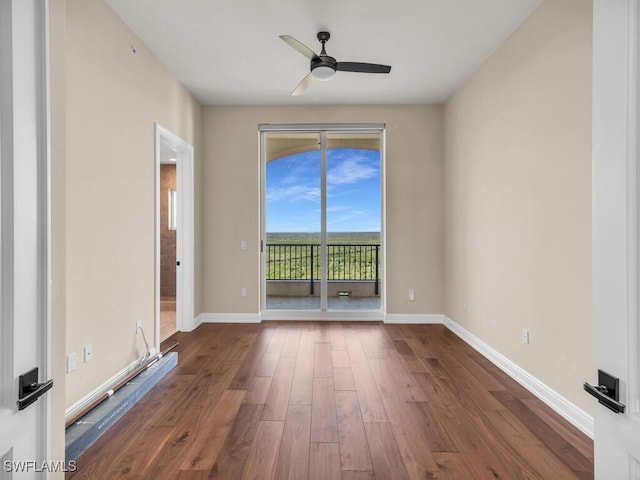 unfurnished room with wood-type flooring and ceiling fan