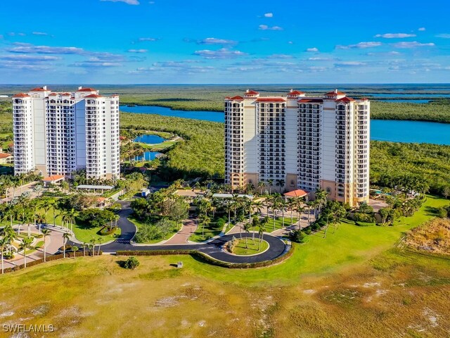 birds eye view of property with a water view