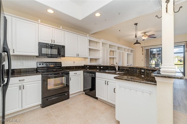 kitchen with kitchen peninsula, sink, white cabinets, and black appliances