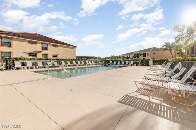 view of swimming pool featuring a patio area