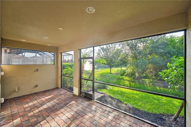 unfurnished sunroom featuring a healthy amount of sunlight