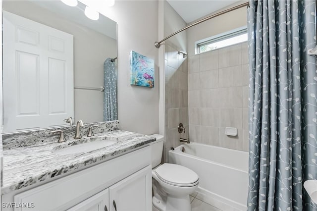 full bathroom with tile patterned flooring, vanity, toilet, and shower / tub combo