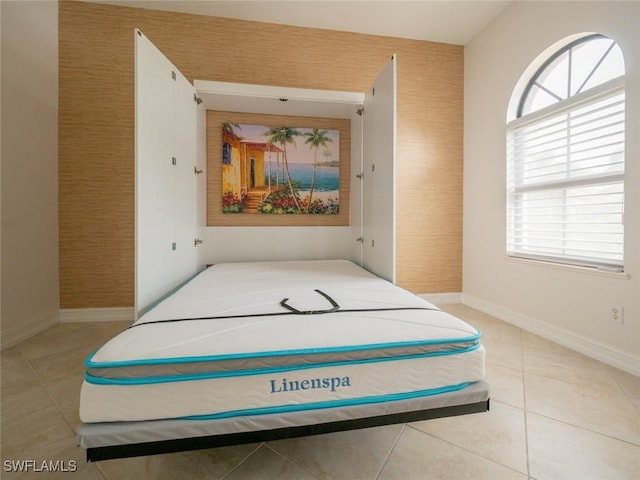 bedroom featuring light tile patterned floors