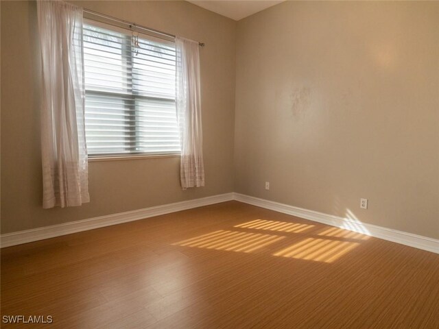 empty room featuring hardwood / wood-style floors