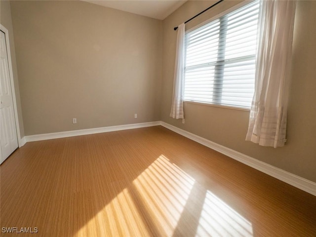 unfurnished room featuring wood-type flooring