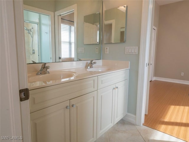 bathroom featuring hardwood / wood-style flooring and vanity