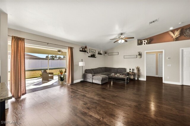 living room with ceiling fan, dark hardwood / wood-style flooring, and lofted ceiling