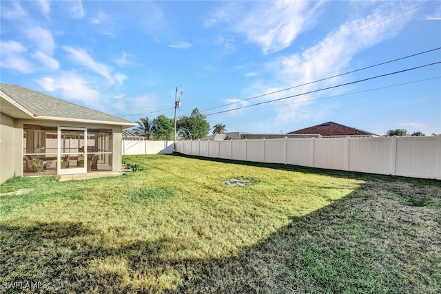 view of yard featuring a sunroom