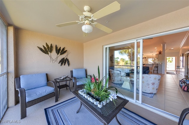 exterior space with ceiling fan and a balcony