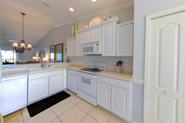 kitchen with lofted ceiling, sink, white cabinets, and white appliances