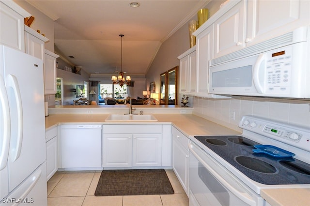 kitchen featuring white appliances, vaulted ceiling, sink, light tile patterned floors, and a chandelier