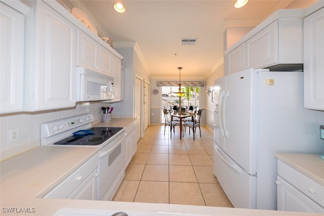 kitchen featuring white appliances, crown molding, light tile patterned floors, white cabinetry, and hanging light fixtures