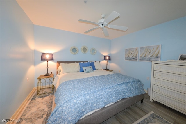 bedroom with hardwood / wood-style flooring and ceiling fan