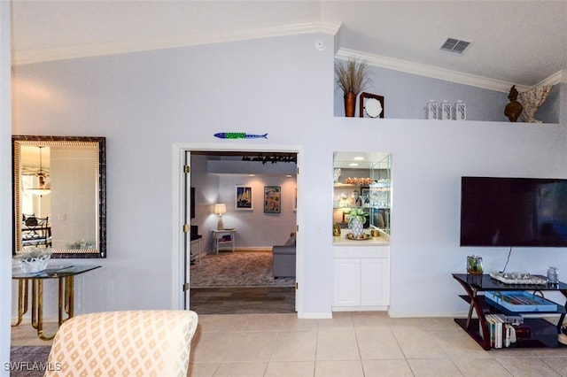 tiled living room with vaulted ceiling and crown molding